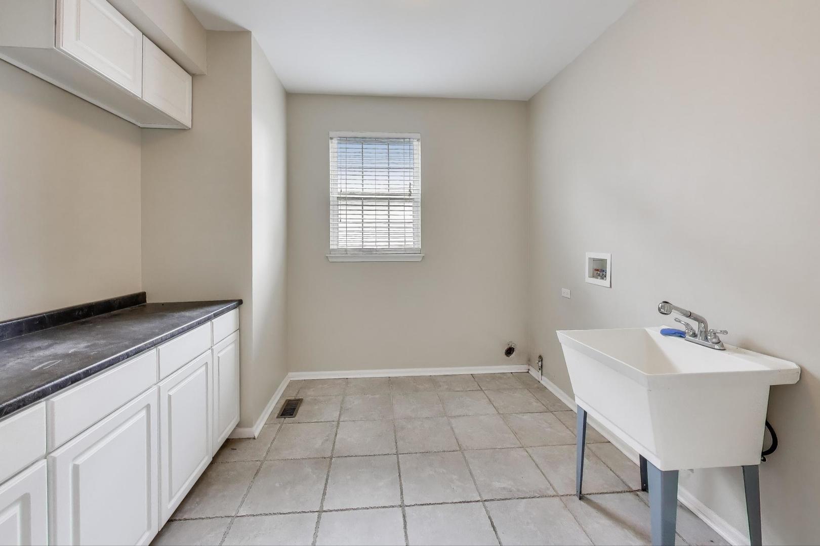 9699 Fairfield Road Huntley, IL 60142 - Photo 21 of 59 a bathroom with a sink and a mirror