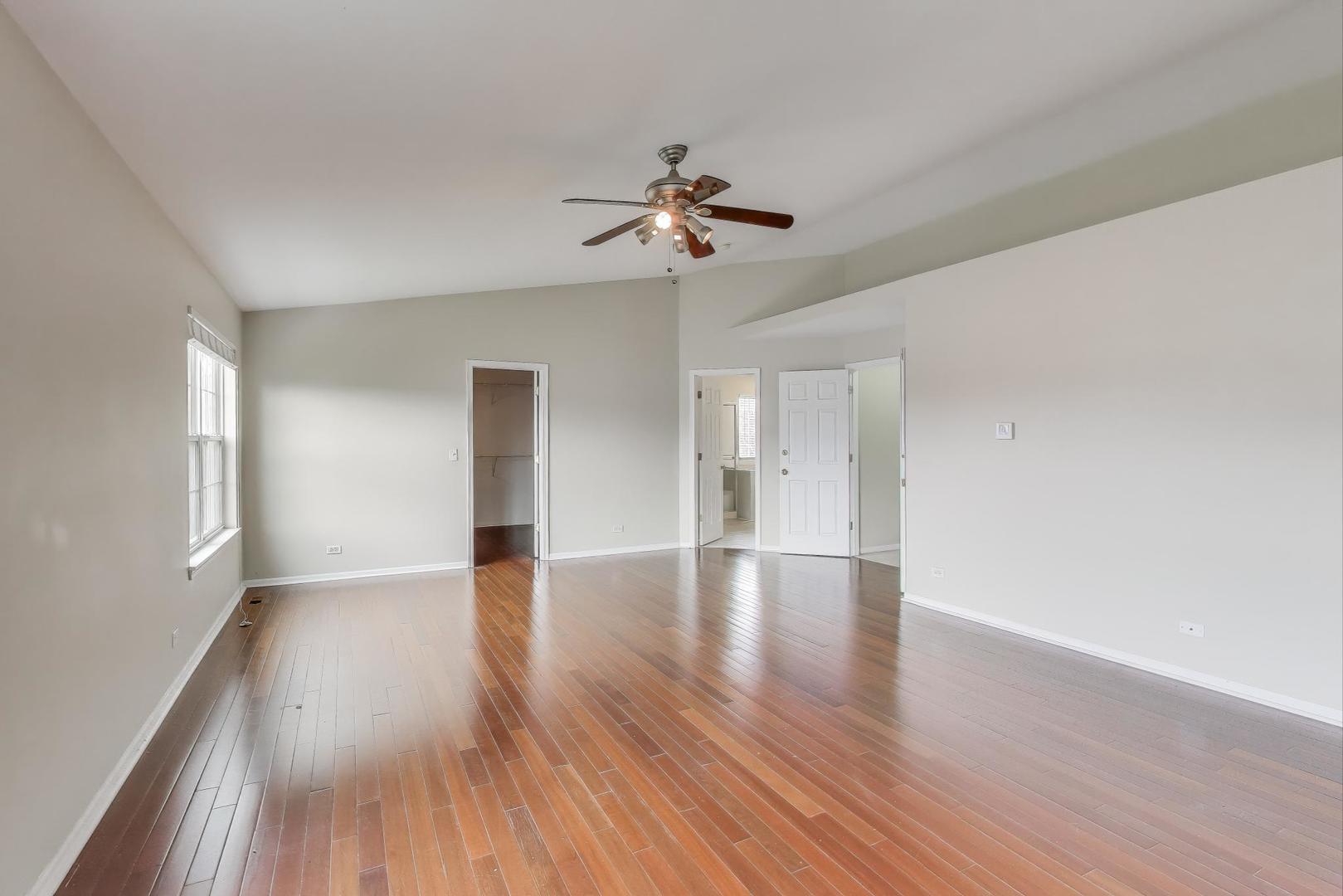 9699 Fairfield Road Huntley, IL 60142 - Photo 26 of 59 wooden floor in an empty room with a window