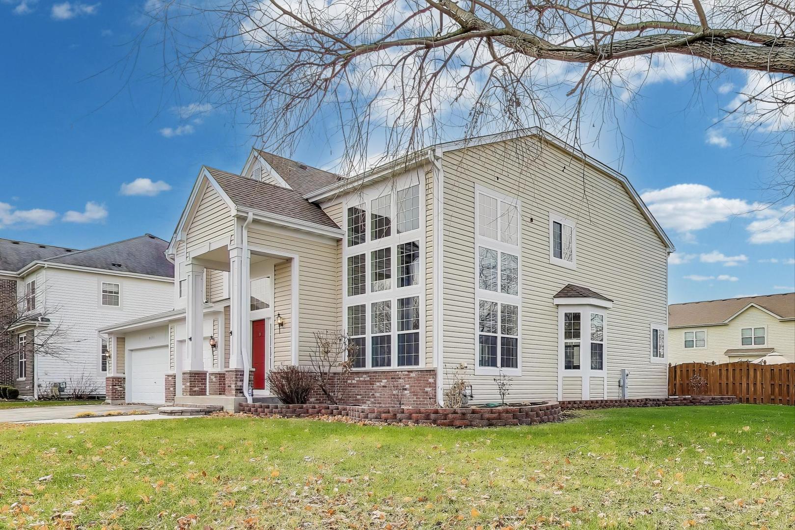 9699 Fairfield Road Huntley, IL 60142 - Photo 3 of 59 a view of a house with a yard