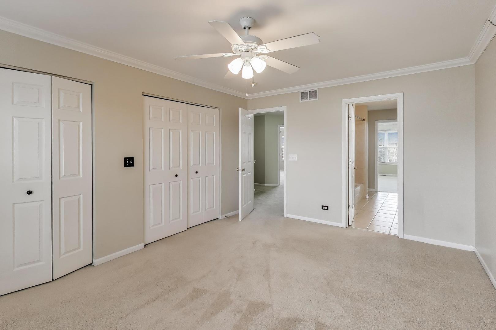 9699 Fairfield Road Huntley, IL 60142 - Photo 34 of 59 a view of an empty room with a ceiling fan