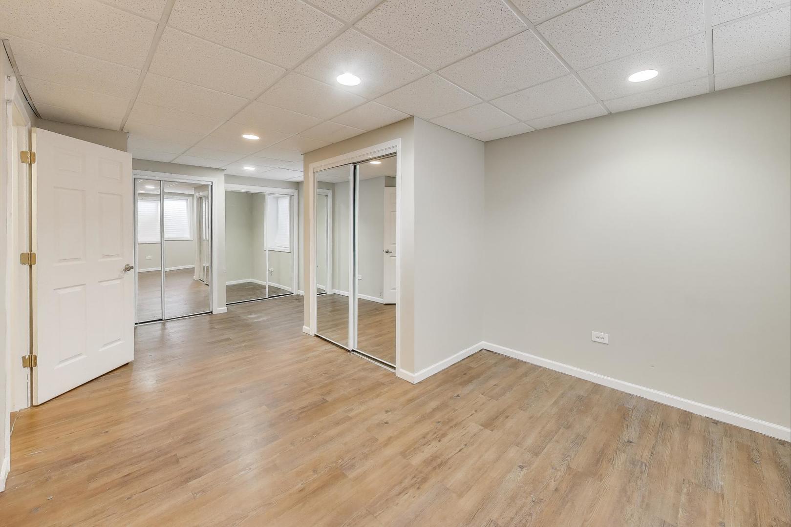 9699 Fairfield Road Huntley, IL 60142 - Photo 46 of 59 a view of empty room with wooden floor