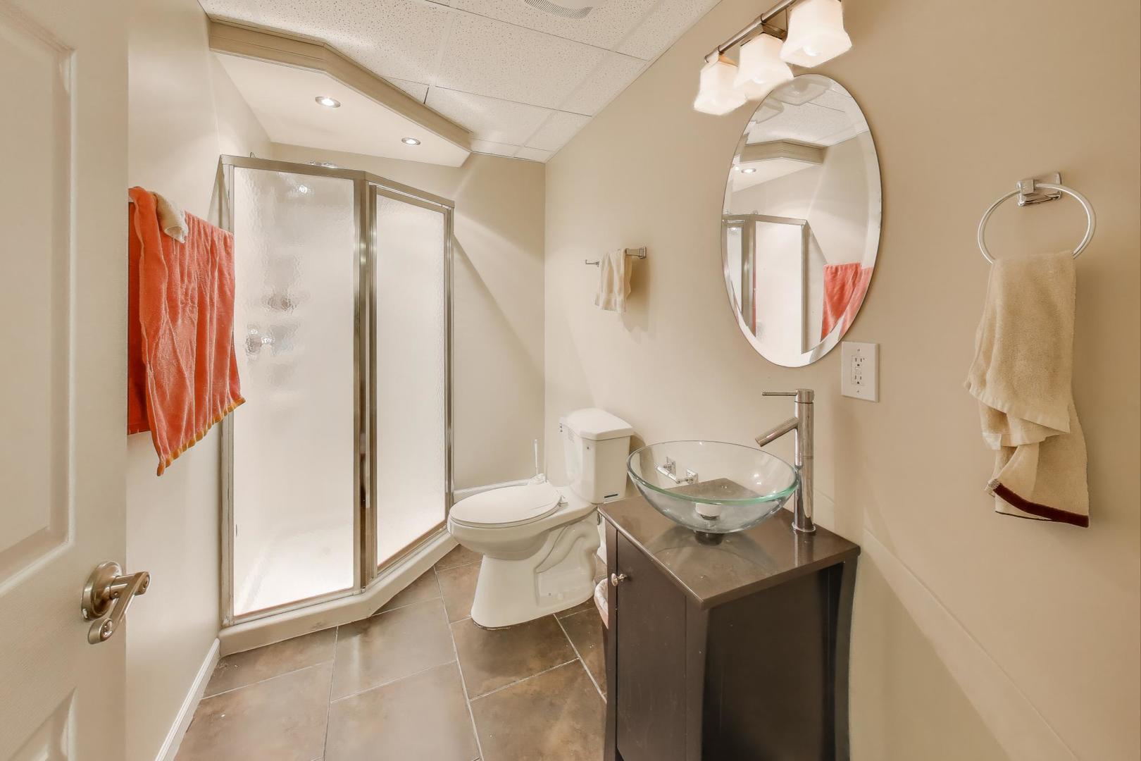 9699 Fairfield Road Huntley, IL 60142 - Photo 48 of 59 a bathroom with a toilet sink and mirror
