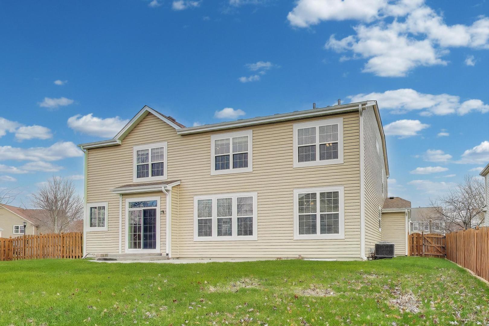9699 Fairfield Road Huntley, IL 60142 - Photo 51 of 59 a front view of a house with a yard