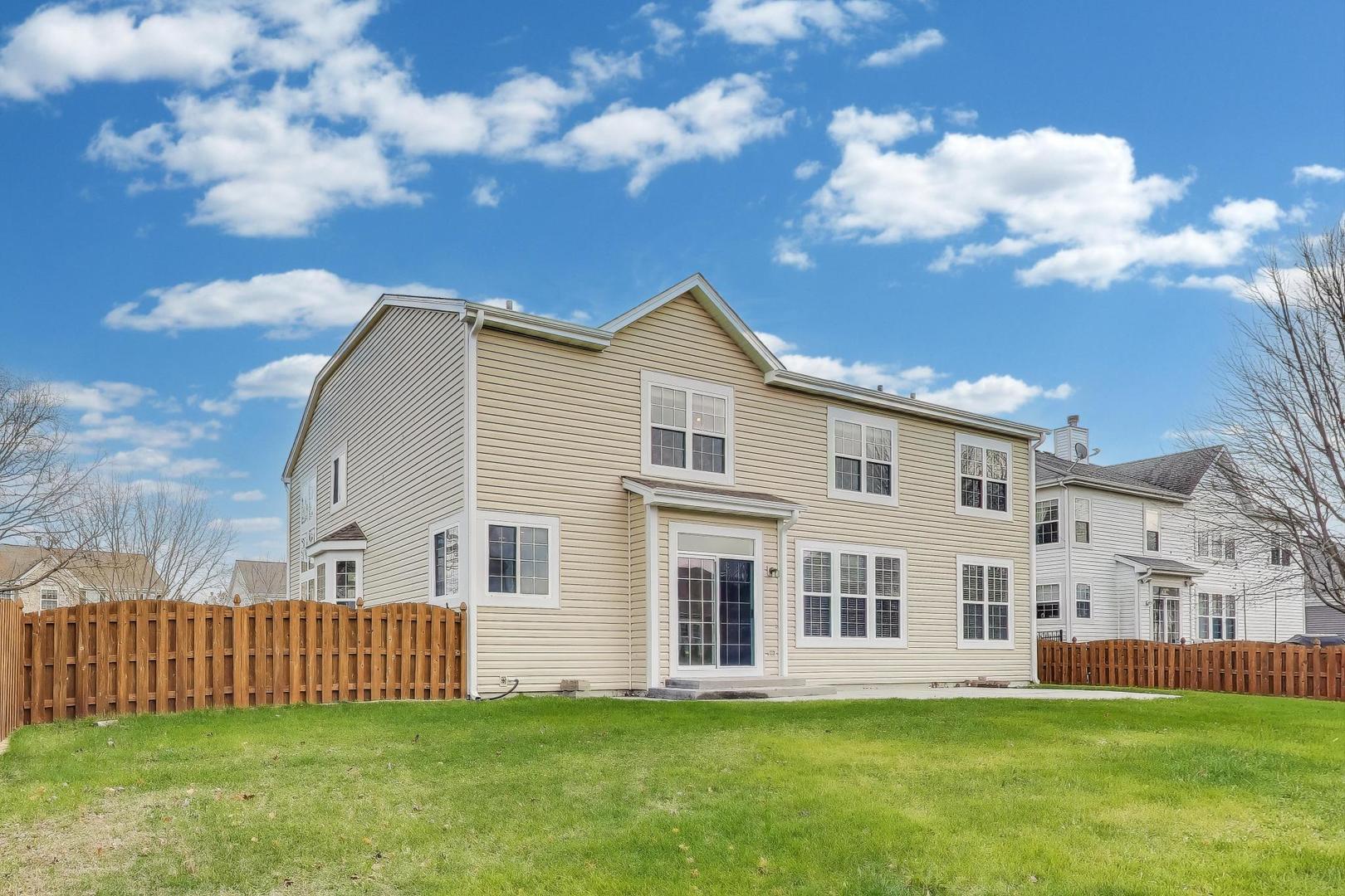 9699 Fairfield Road Huntley, IL 60142 - Photo 52 of 59 a view of a house with a yard
