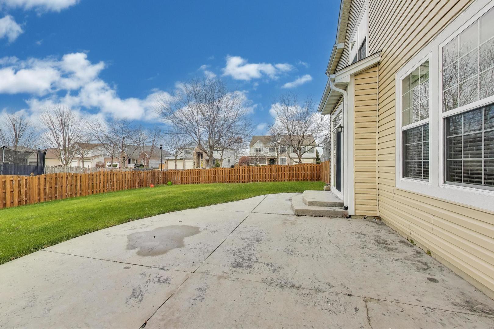 9699 Fairfield Road Huntley, IL 60142 - Photo 54 of 59 a view of a house with a yard