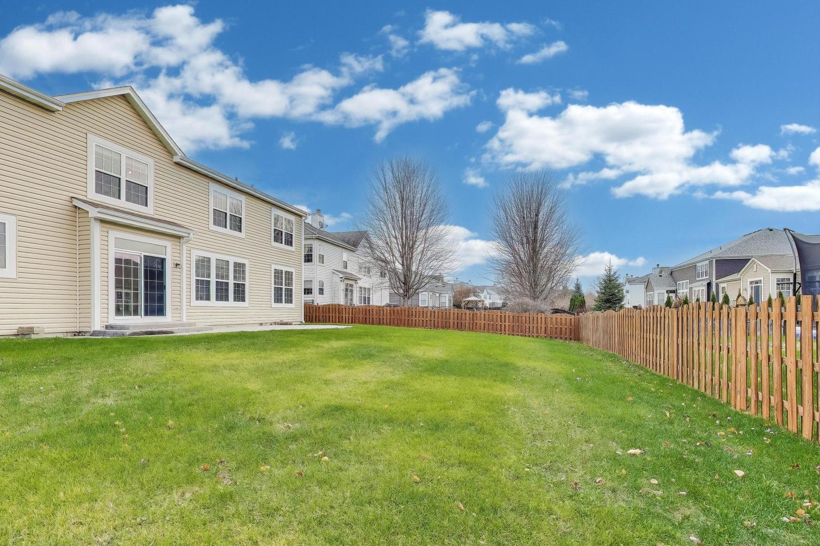 9699 Fairfield Road Huntley, IL 60142 - Photo 56 of 59 a view of a backyard with plants and a garden