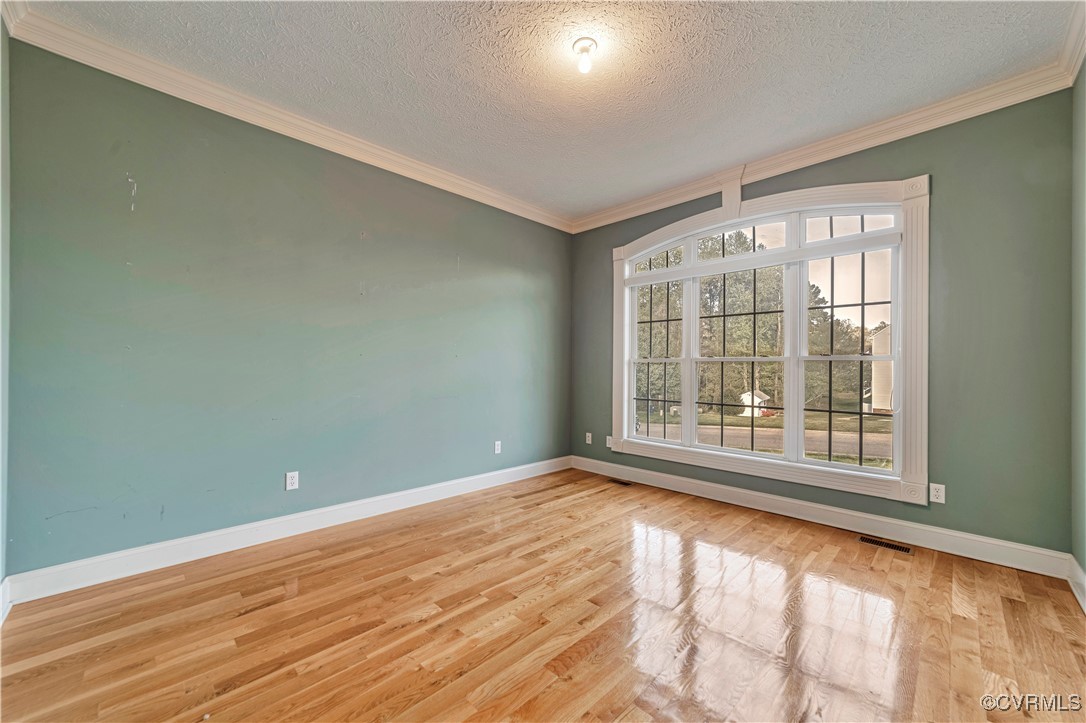 5000 Faraday Drive Chester, VA 23831 - Photo 12 of 40 a view of empty room with wooden floor and fan