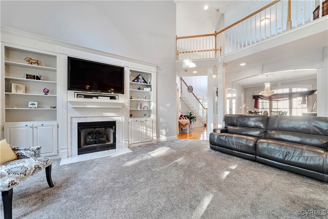 5000 Faraday Drive Chester, VA 23831 - Photo 15 of 40 a living room with furniture a flat screen tv and a fireplace