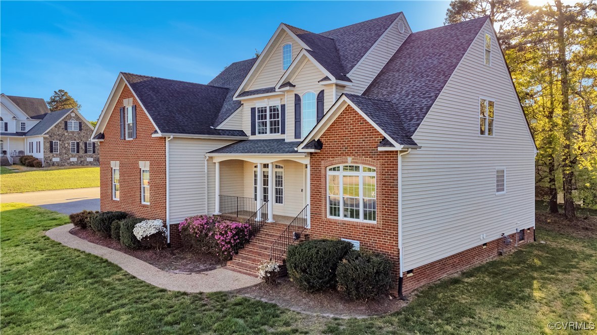 5000 Faraday Drive Chester, VA 23831 - Photo 2 of 40 a front view of a house with swimming pool having outdoor seating