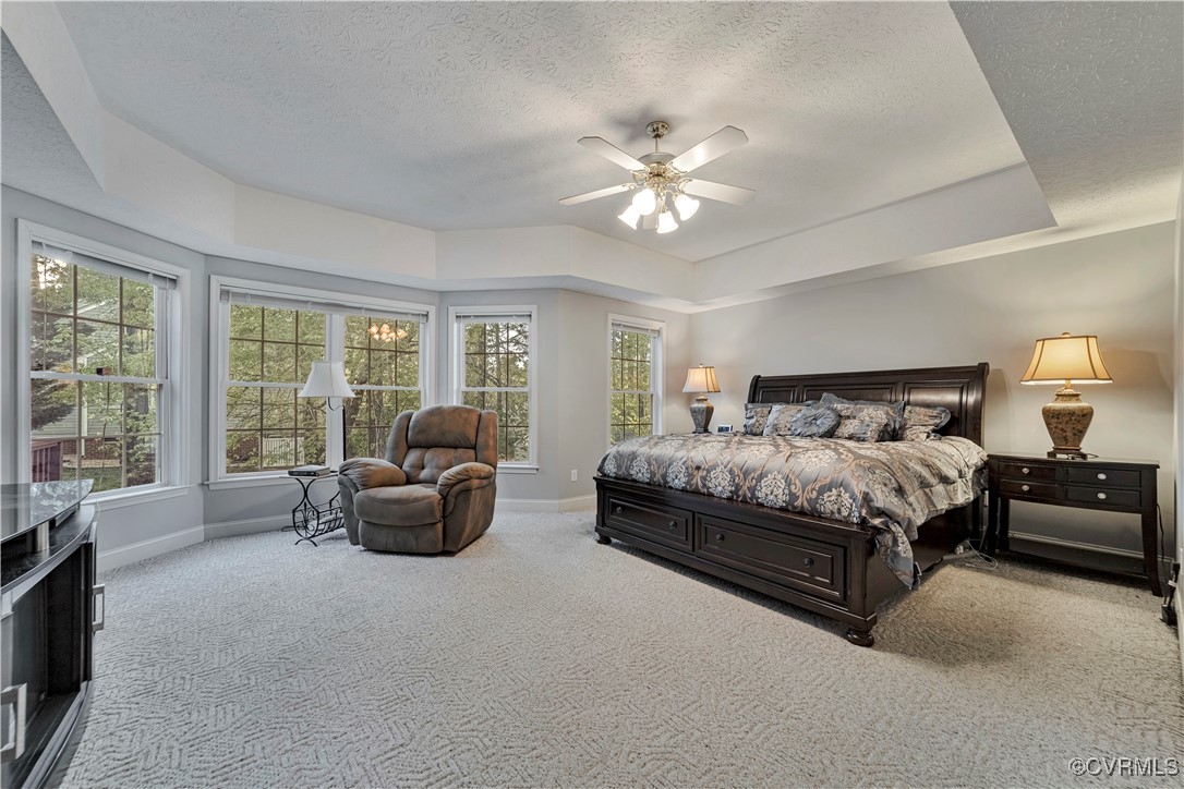 5000 Faraday Drive Chester, VA 23831 - Photo 23 of 40 a spacious bedroom with a bed and a couch