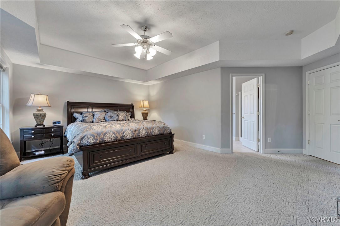 5000 Faraday Drive Chester, VA 23831 - Photo 24 of 40 a bedroom with a bed and lamp