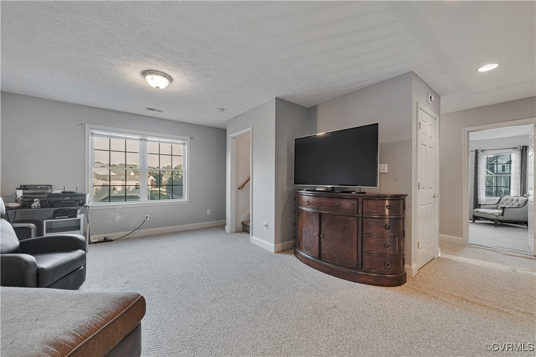5000 Faraday Drive Chester, VA 23831 - Photo 29 of 40 a living room with furniture and a flat screen tv