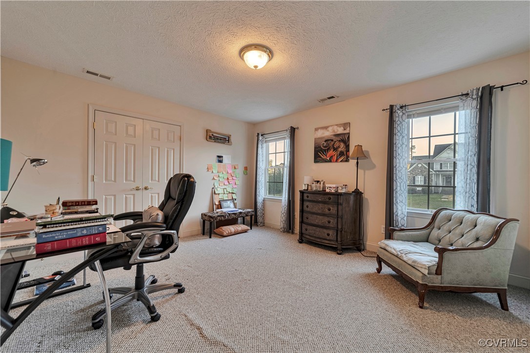 5000 Faraday Drive Chester, VA 23831 - Photo 36 of 40 a living room with furniture gym equipment and a window