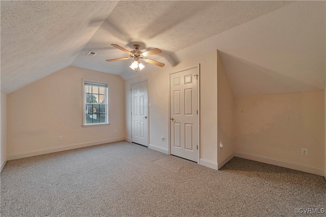 5000 Faraday Drive Chester, VA 23831 - Photo 39 of 40 an empty room with windows and fan