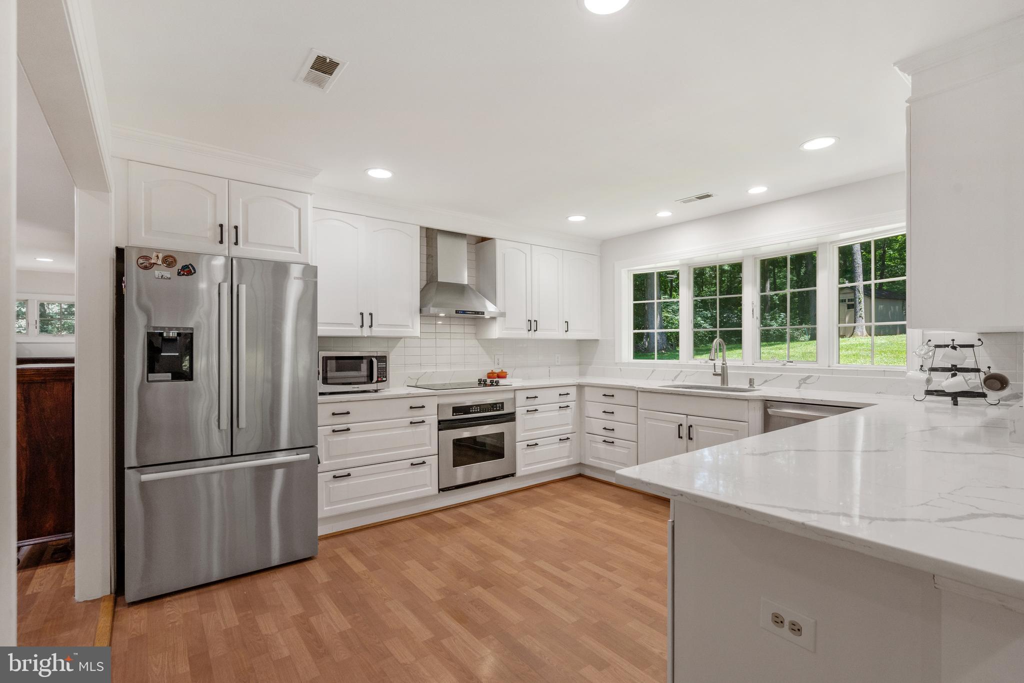 10418 Adel Road Oakton, VA 22124 - Photo 4 of 51 White Quartz Counters/Stainless appliances