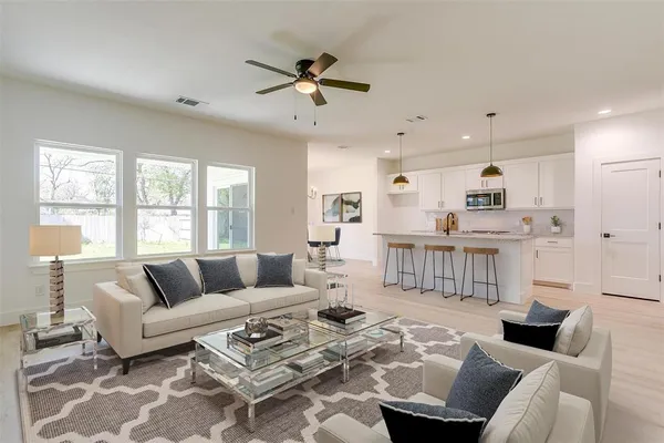 a living room with furniture and a large window