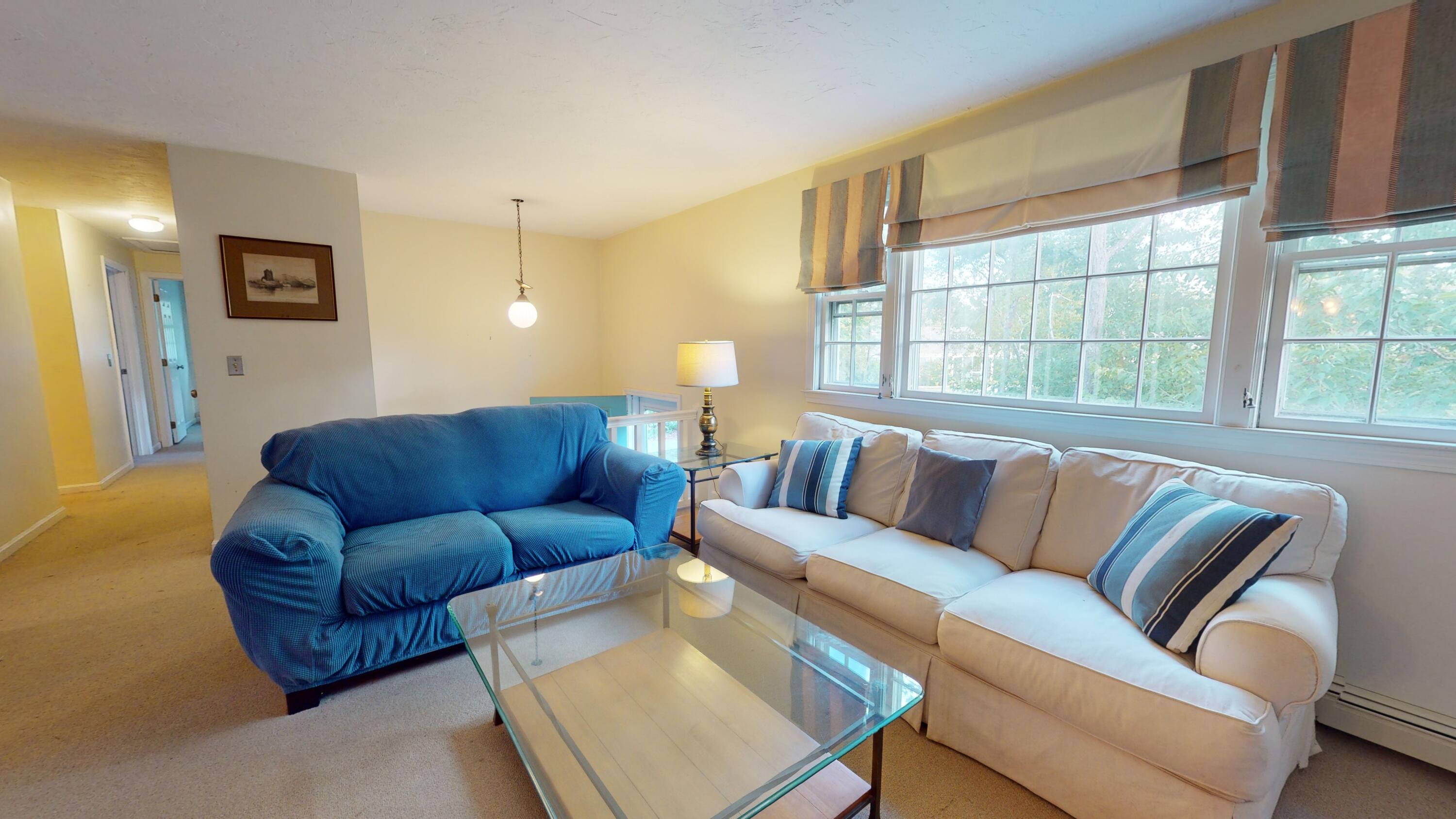 17 Toms Path Dennis Port, MA 02639 - Photo 11 of 31 a living room with furniture and a large window