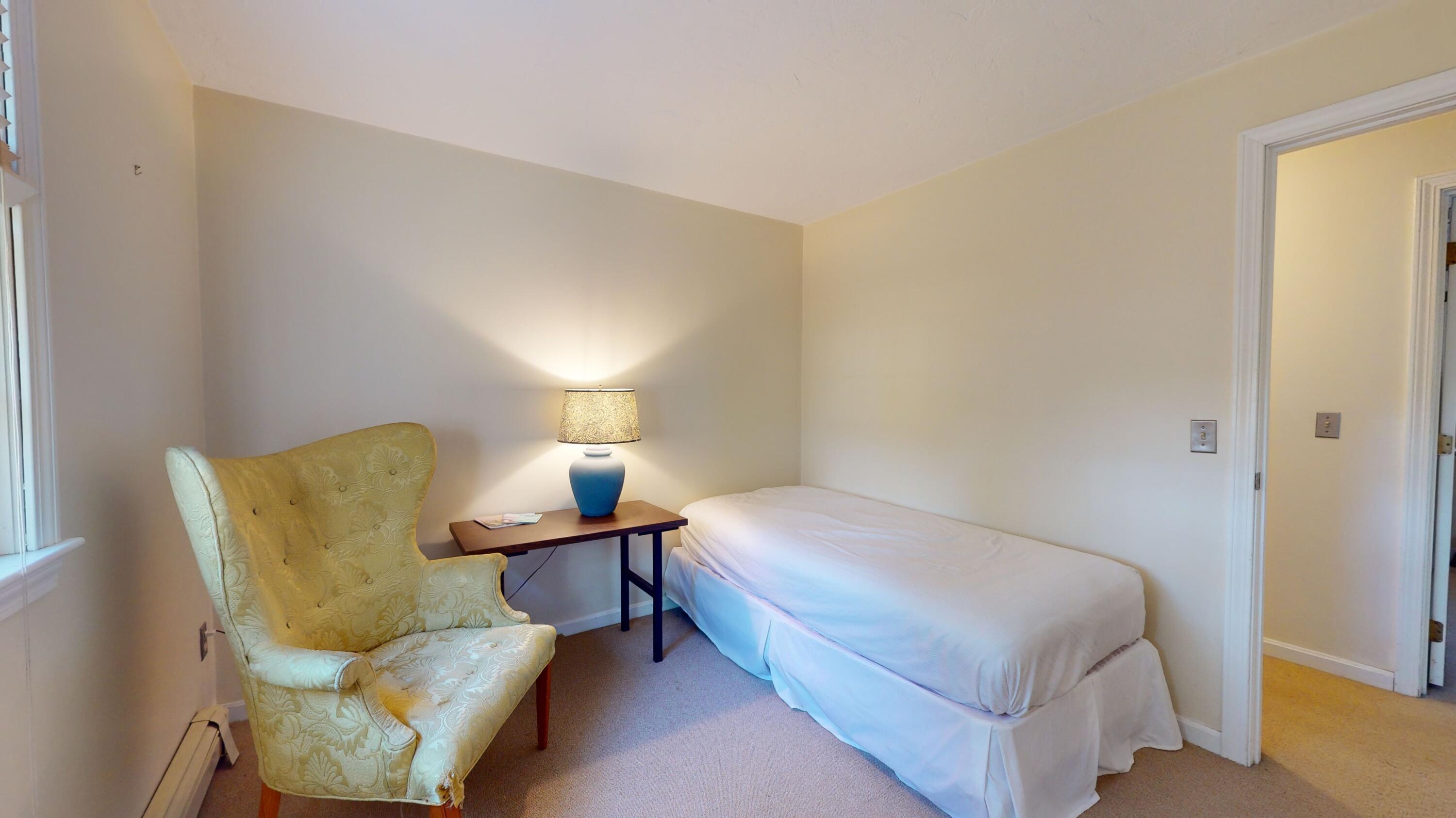 17 Toms Path Dennis Port, MA 02639 - Photo 14 of 31 a bedroom with a bed and lamp