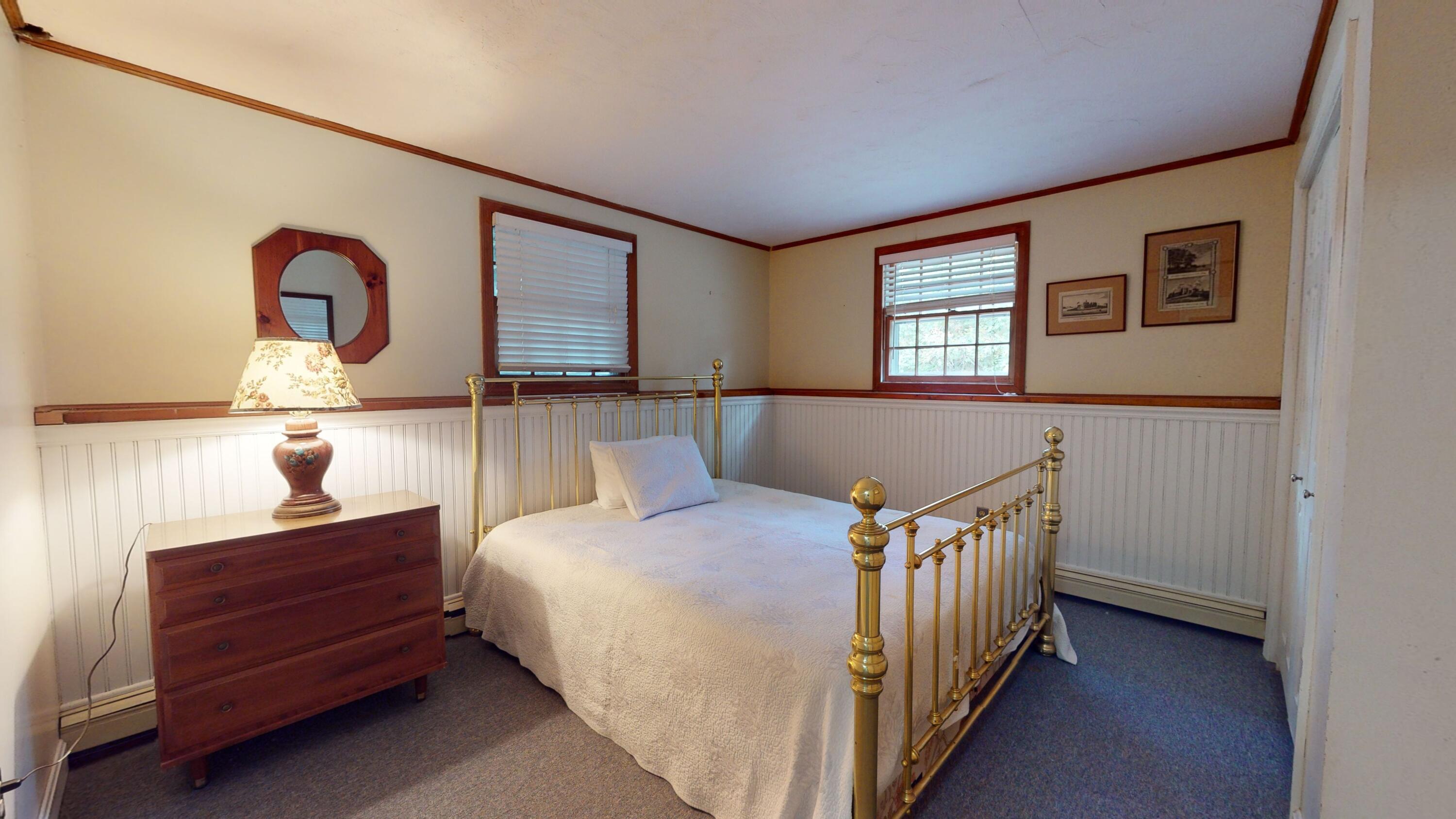 17 Toms Path Dennis Port, MA 02639 - Photo 17 of 31 a bedroom with a bed and a night stand next to a window
