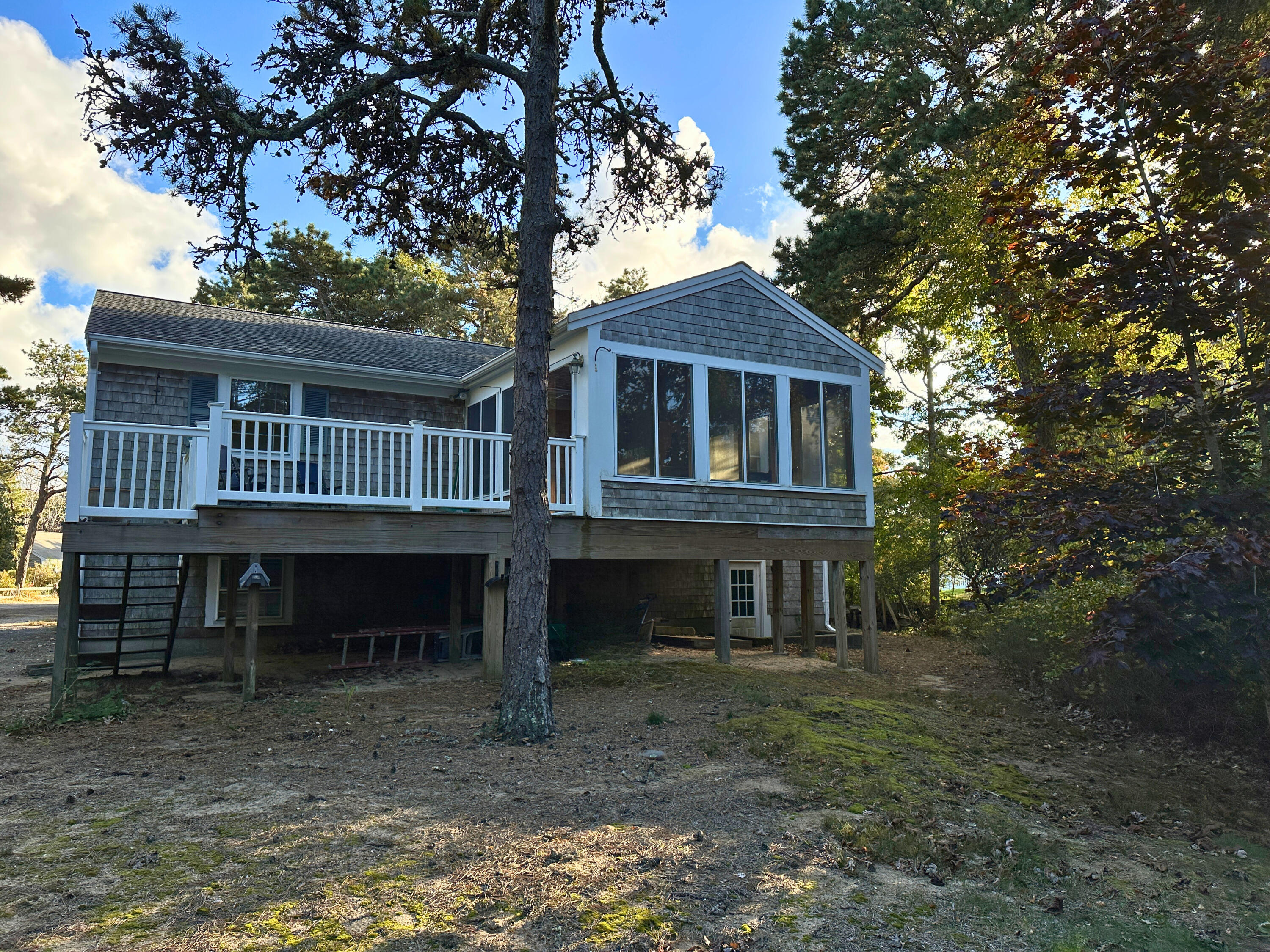 17 Toms Path Dennis Port, MA 02639 - Photo 2 of 31 a front view of a house with a yard