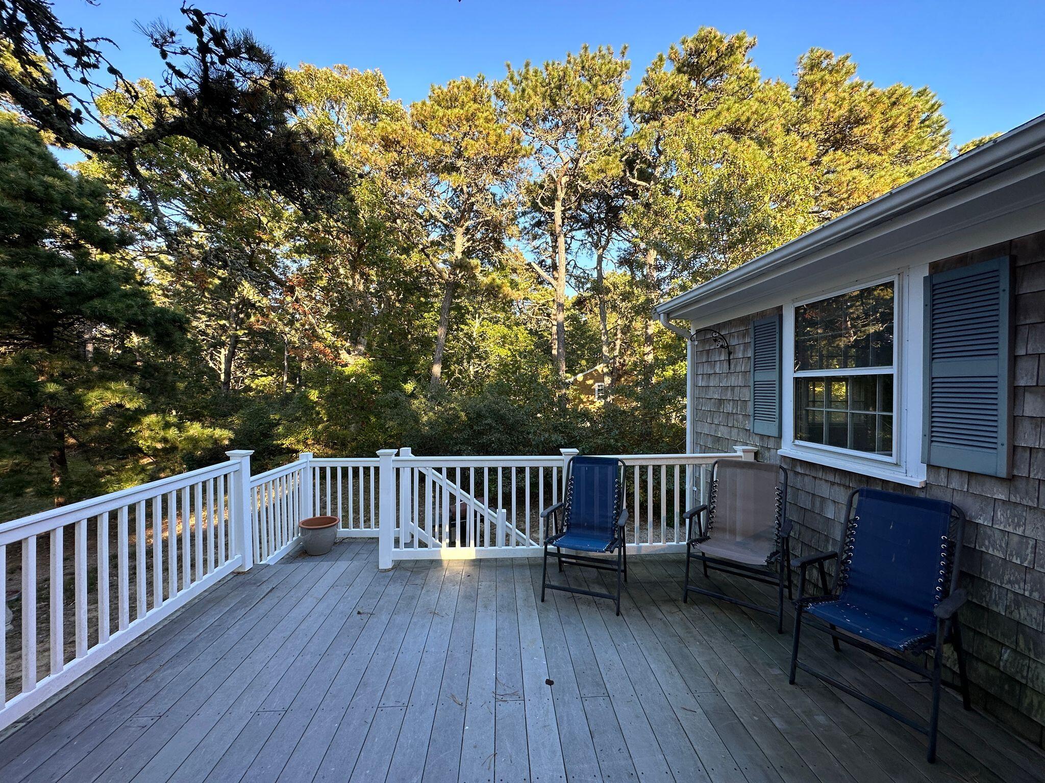 17 Toms Path Dennis Port, MA 02639 - Photo 23 of 31 a view of backyard with a deck and wooden floor