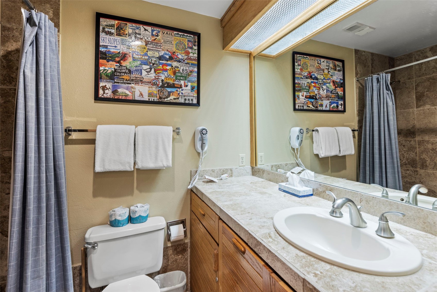 1211 West Keystone Road, Unit 2736 Keystone, CO 80435 - Photo 15 of 35 a bathroom with a sink mirror and toilet
