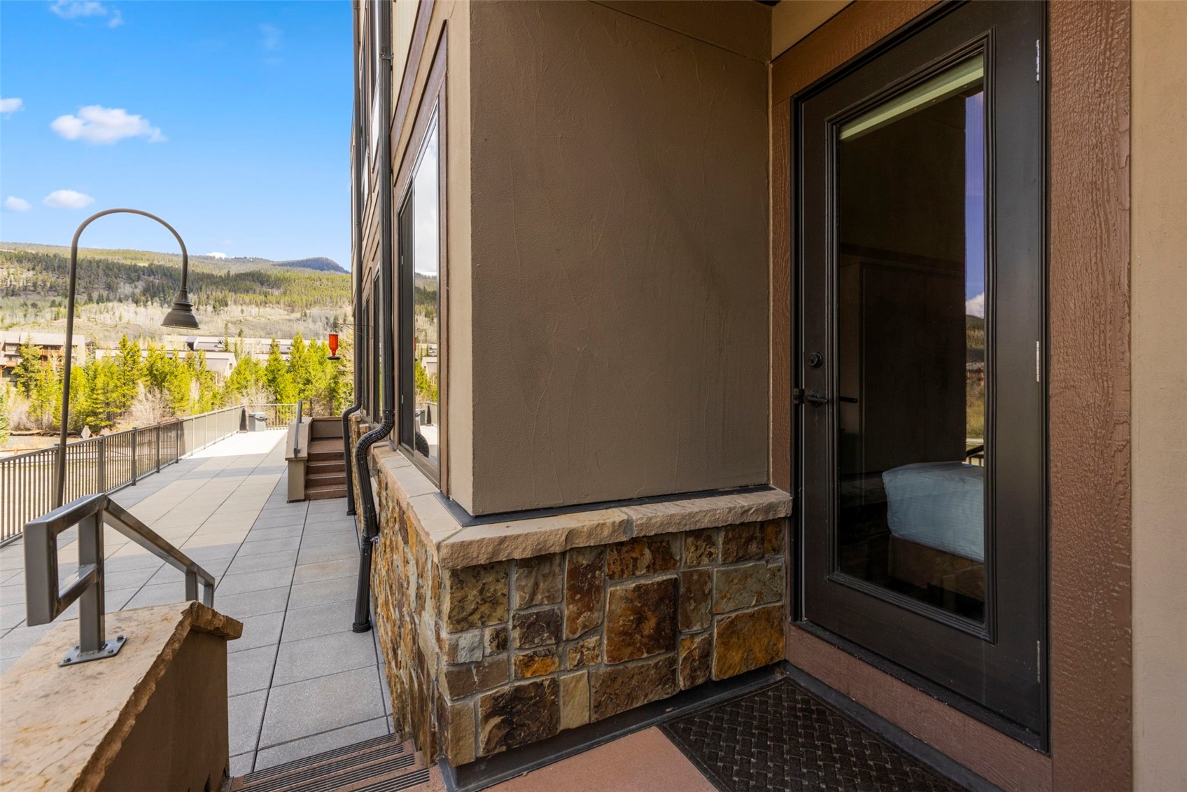 1211 West Keystone Road, Unit 2736 Keystone, CO 80435 - Photo 19 of 35 a view of a balcony having floor to ceiling window wooden floor