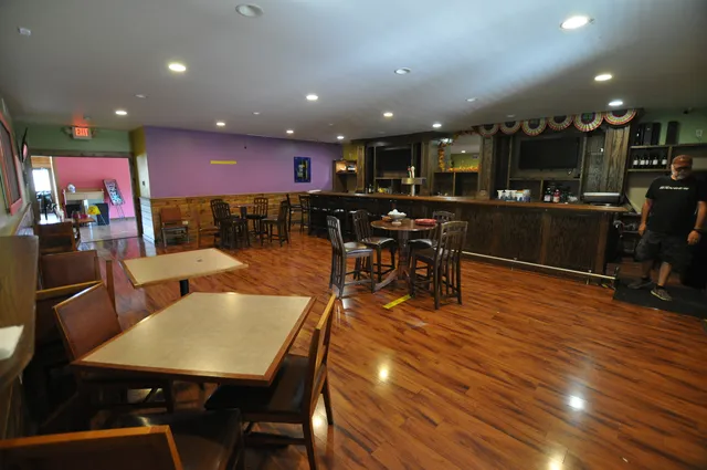 a view of a dining area with furniture and wooden floor