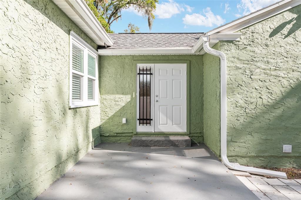 742 Southeast 12th Street Ocala, FL 34471 - Photo 26 of 44 a front view of a house with a yard