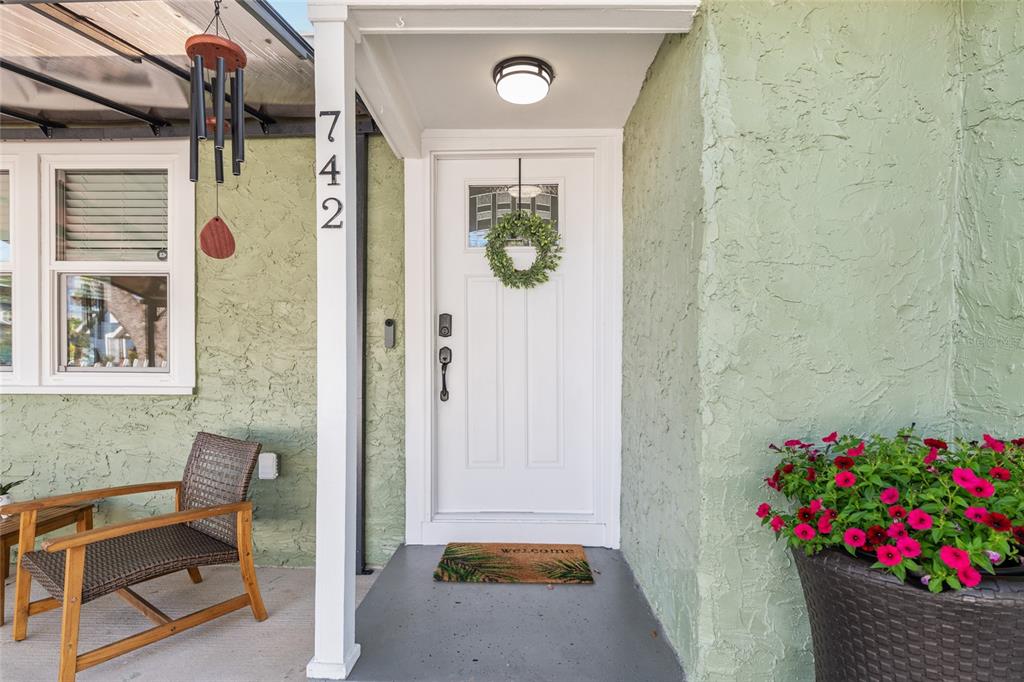 742 Southeast 12th Street Ocala, FL 34471 - Photo 4 of 44 a front view of a house with entryway