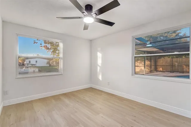a large bathroom with a double vanity sink and mirror with shower