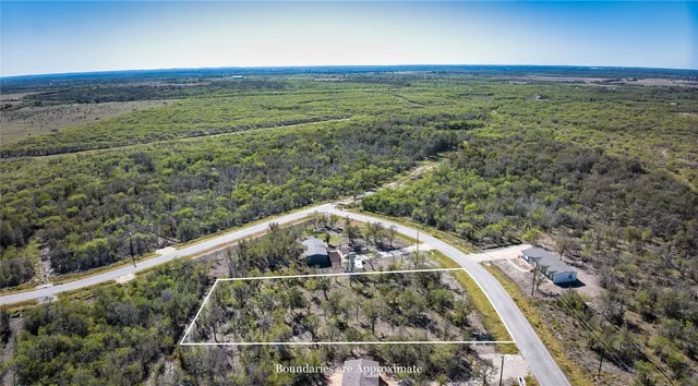 a view of a yard with an outdoor seating