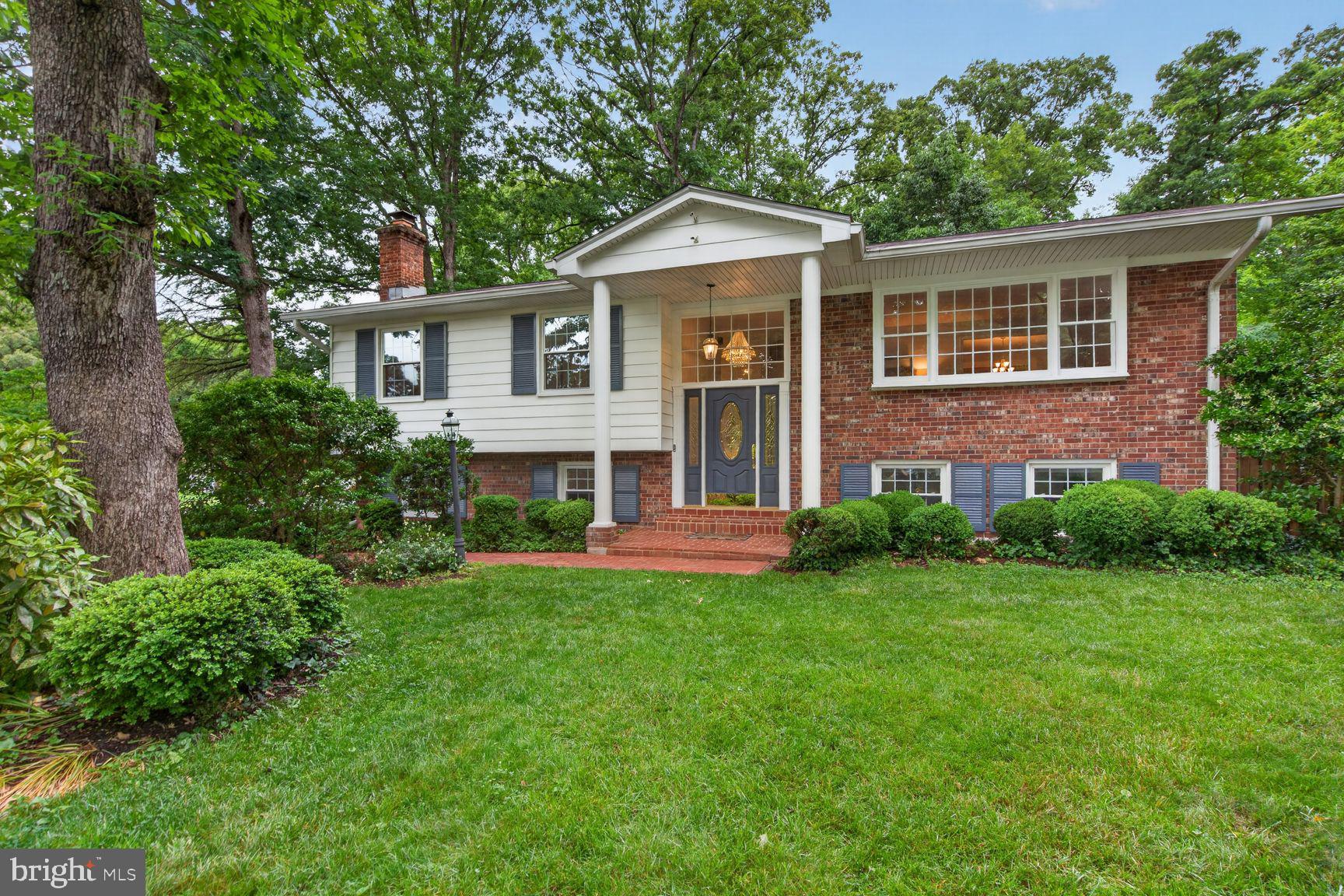 5024 Portsmouth Road Fairfax, VA 22032 - Photo 1 of 38 a front view of a house with a yard and green space