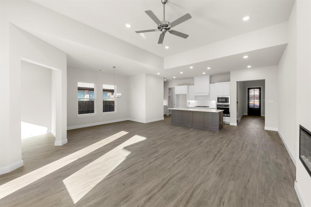 1201 Century Tree Lane Anna, TX 75409 - Photo 15 of 26 a view of kitchen with refrigerator stove and wooden floor