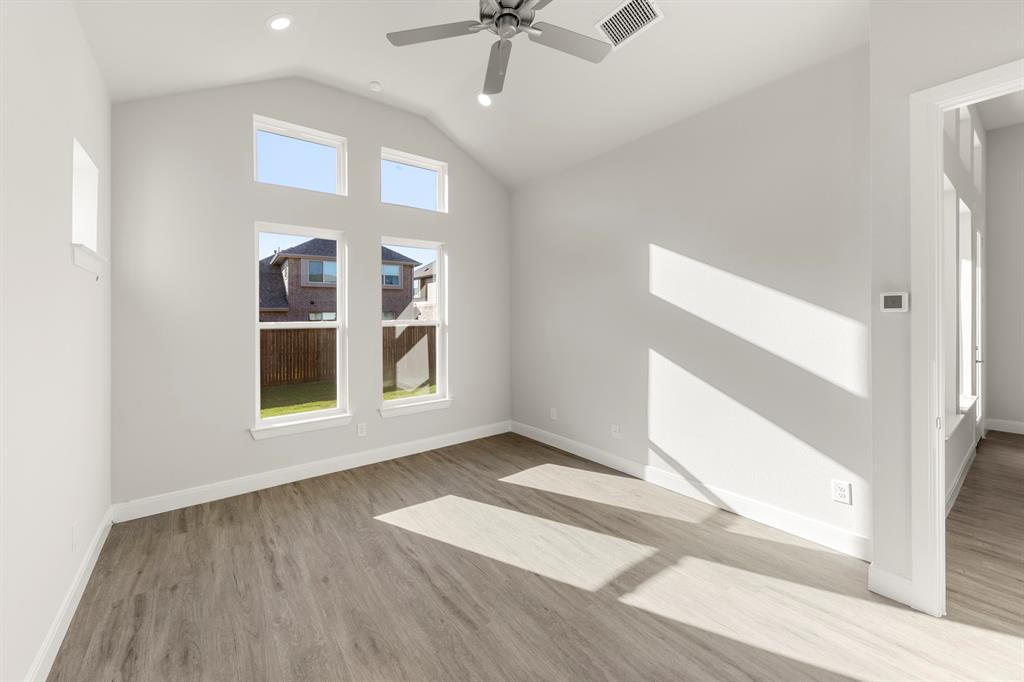1201 Century Tree Lane Anna, TX 75409 - Photo 16 of 26 a view of an empty room with a window and wooden floor
