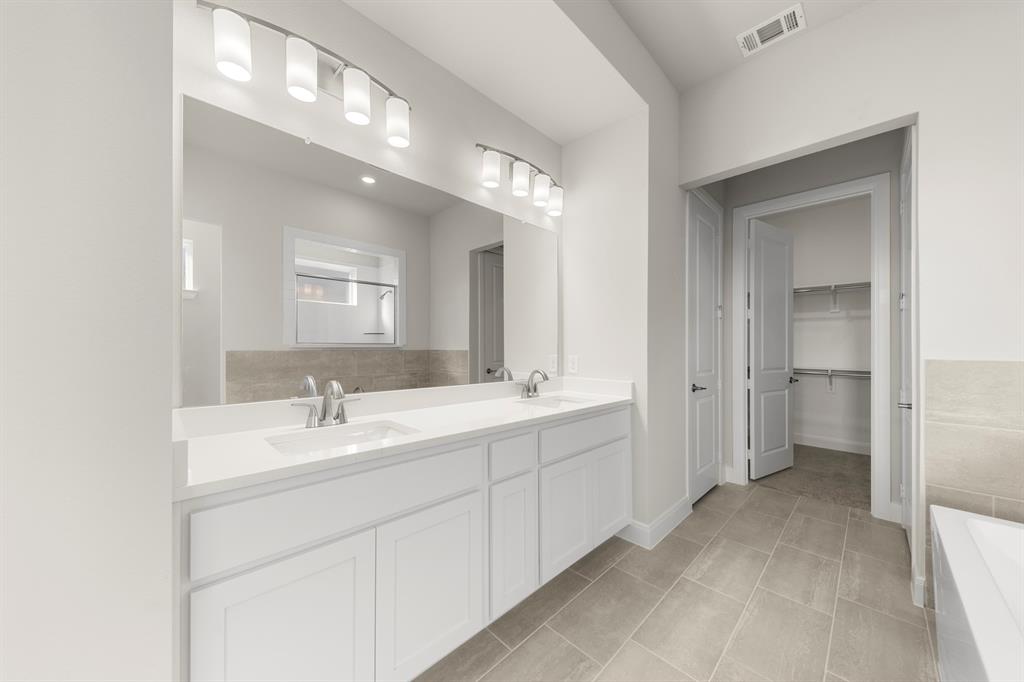 1201 Century Tree Lane Anna, TX 75409 - Photo 18 of 26 a bathroom with a double vanity sink mirror and