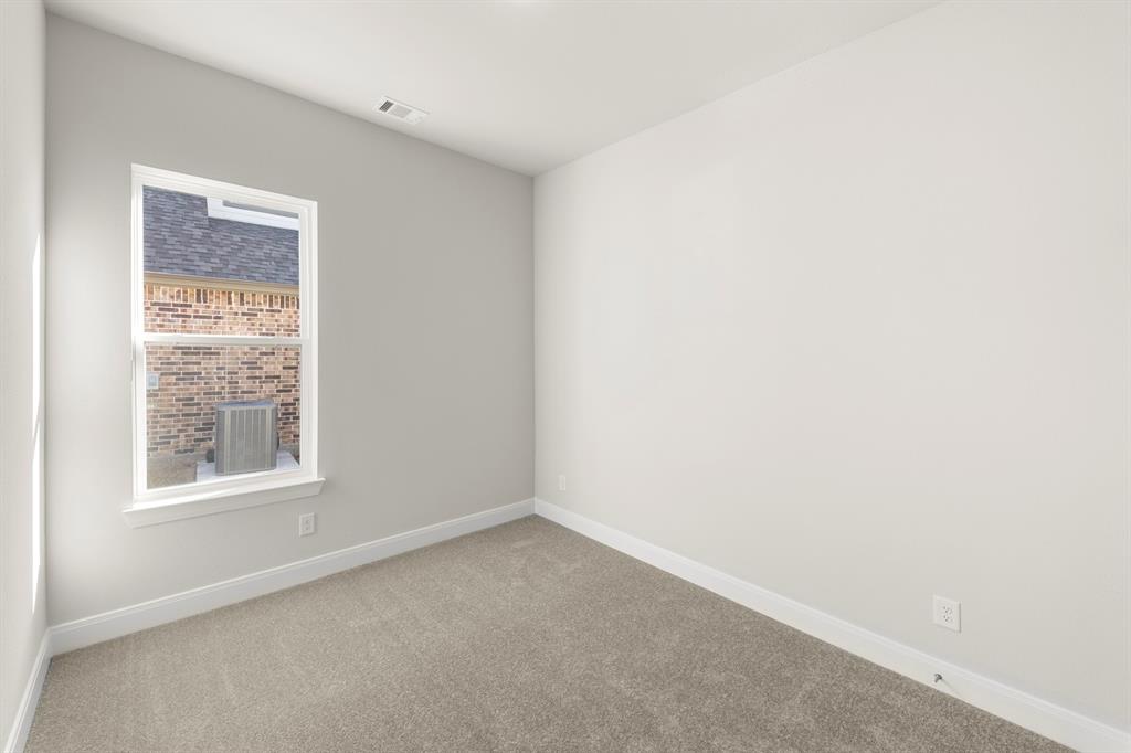 1201 Century Tree Lane Anna, TX 75409 - Photo 5 of 26 an empty room with a window