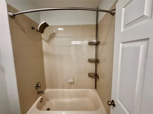 a bathroom with a shower and a shower