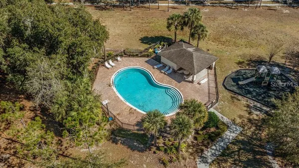 an aerial view of a house with a lake view
