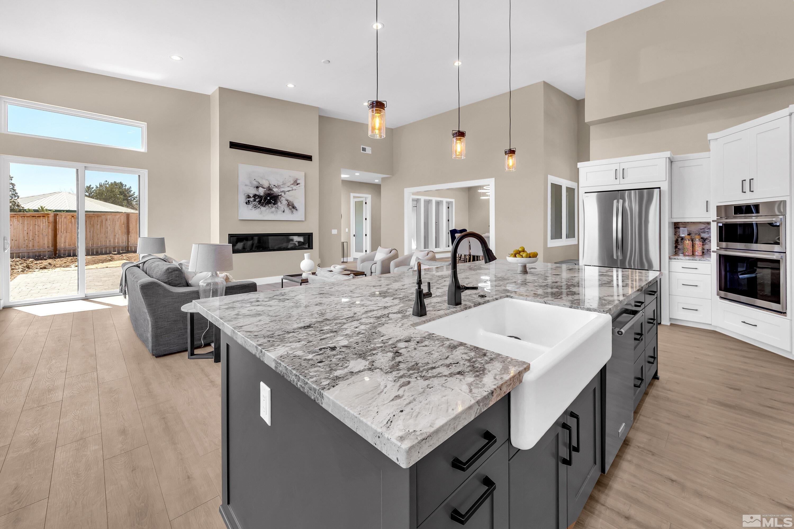 724 Canter Way Reno, NV 89511 - Photo 14 of 40 a large kitchen with kitchen island a large island in it