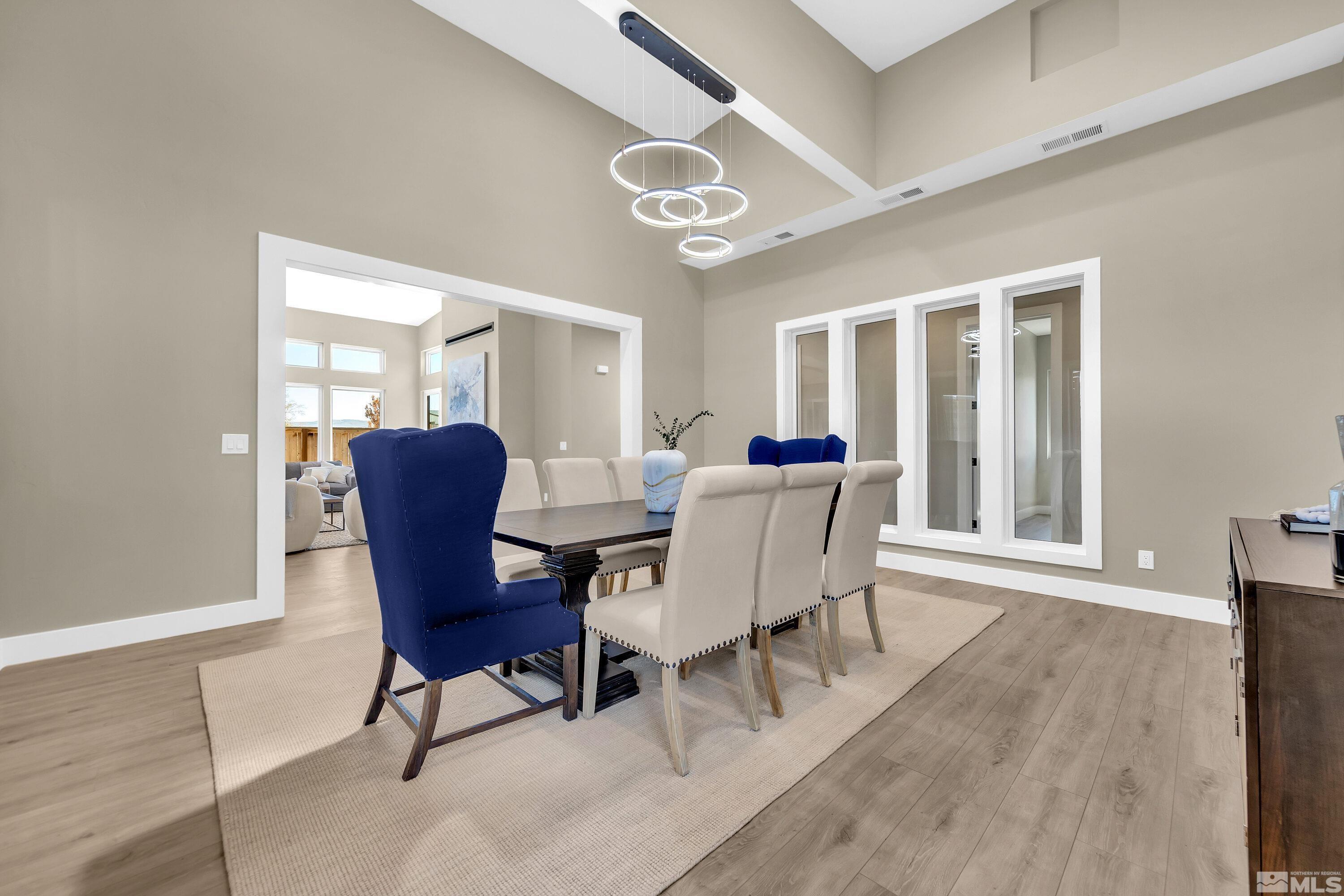 724 Canter Way Reno, NV 89511 - Photo 17 of 40 a view of a dining room with furniture and a window