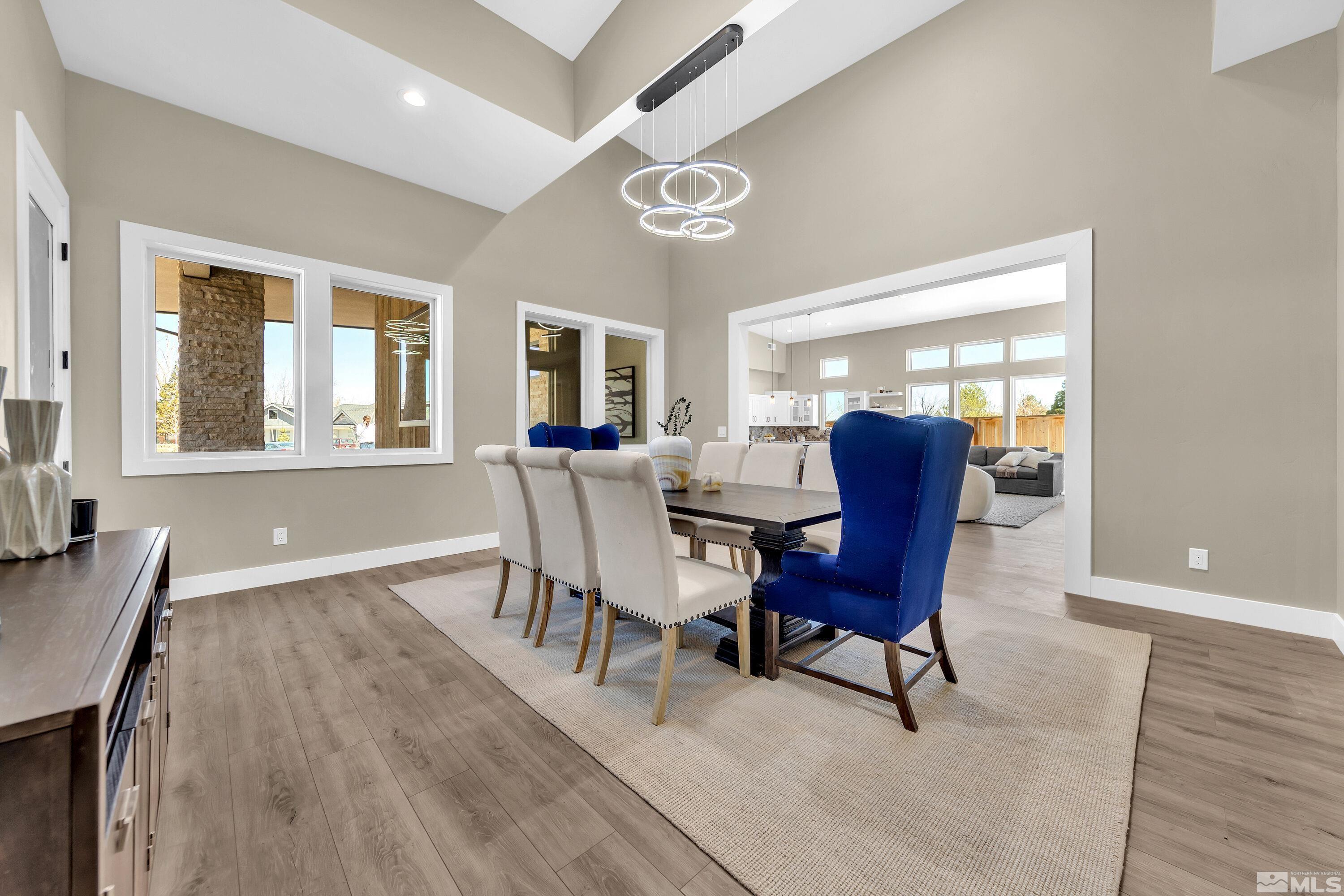 724 Canter Way Reno, NV 89511 - Photo 18 of 40 a view of a dining room with furniture and chandelier