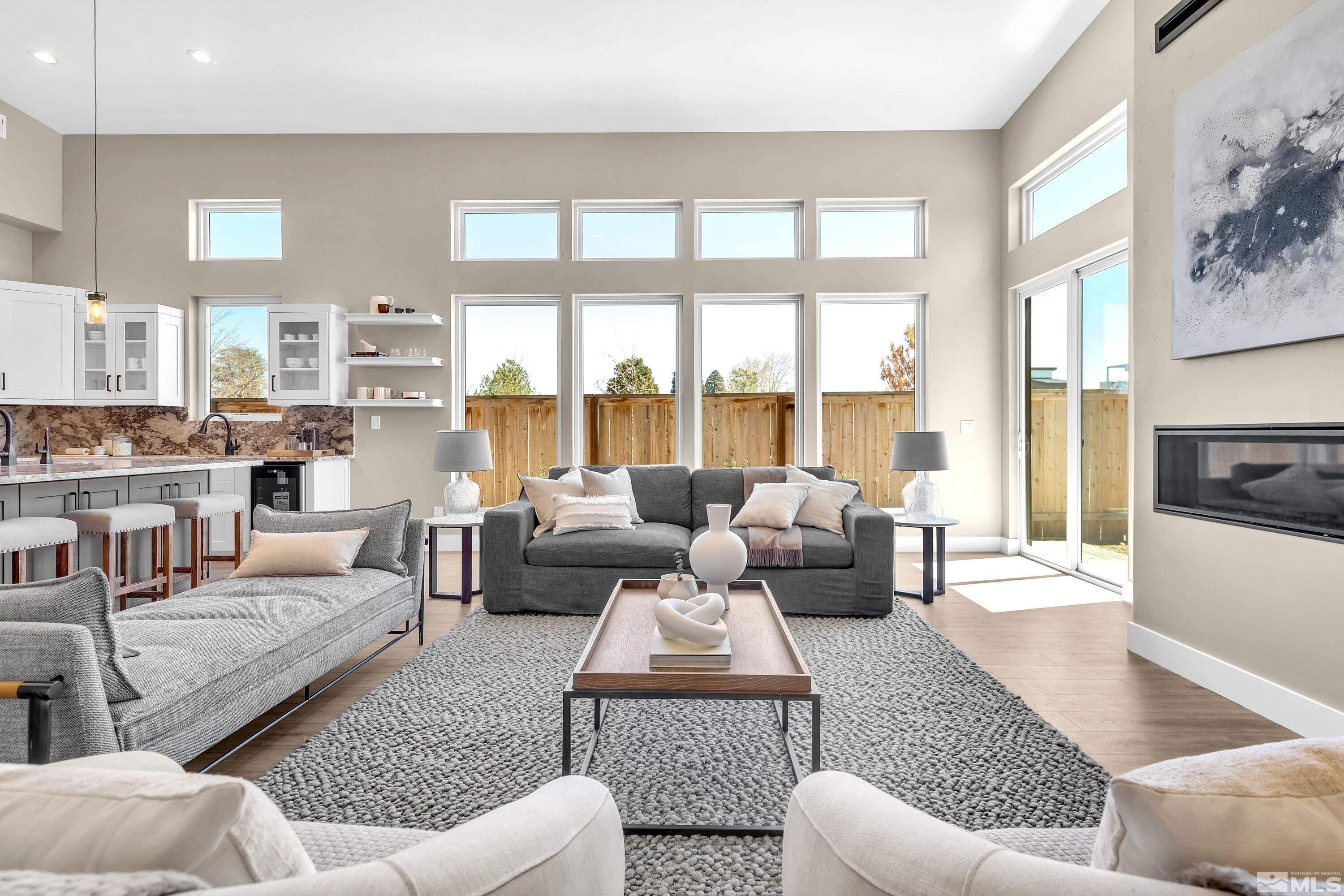 724 Canter Way Reno, NV 89511 - Photo 2 of 40 a living room with furniture or couch and a large window