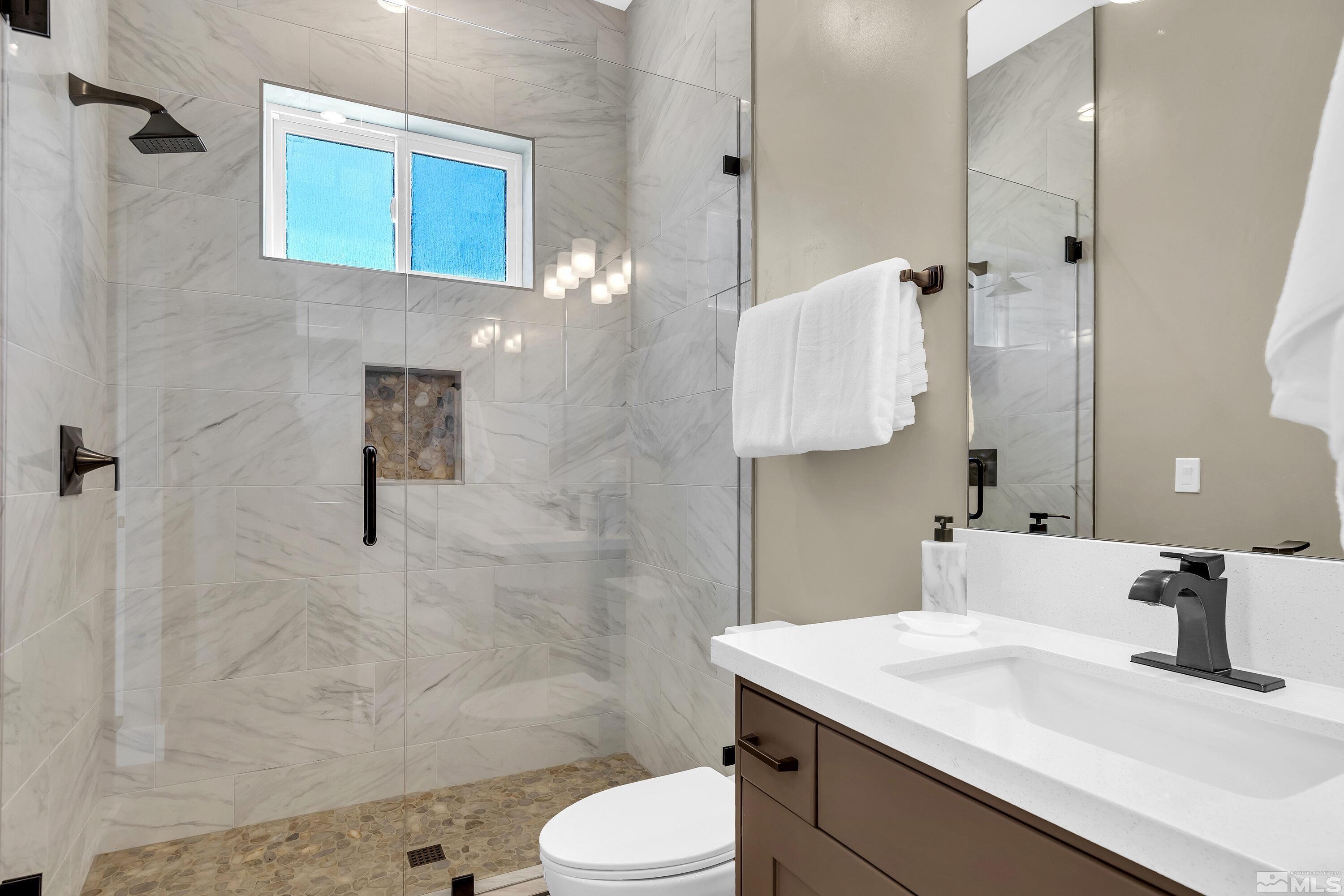 724 Canter Way Reno, NV 89511 - Photo 22 of 40 a bathroom with a sink toilet and shower