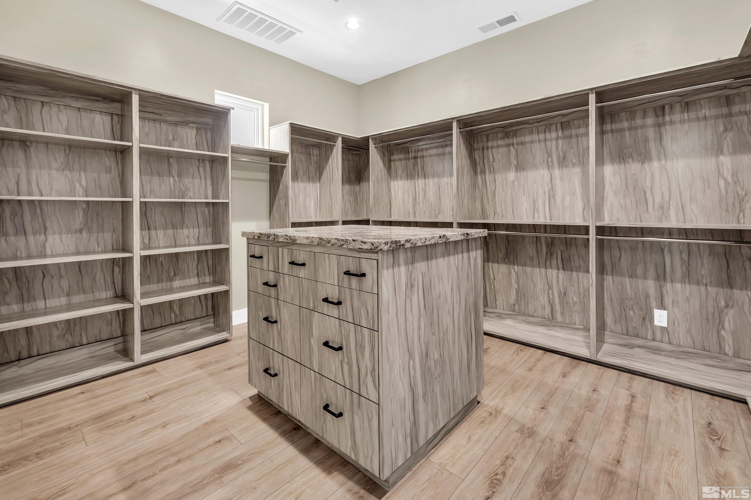 724 Canter Way Reno, NV 89511 - Photo 29 of 40 a kitchen with wooden cabinets and entryway