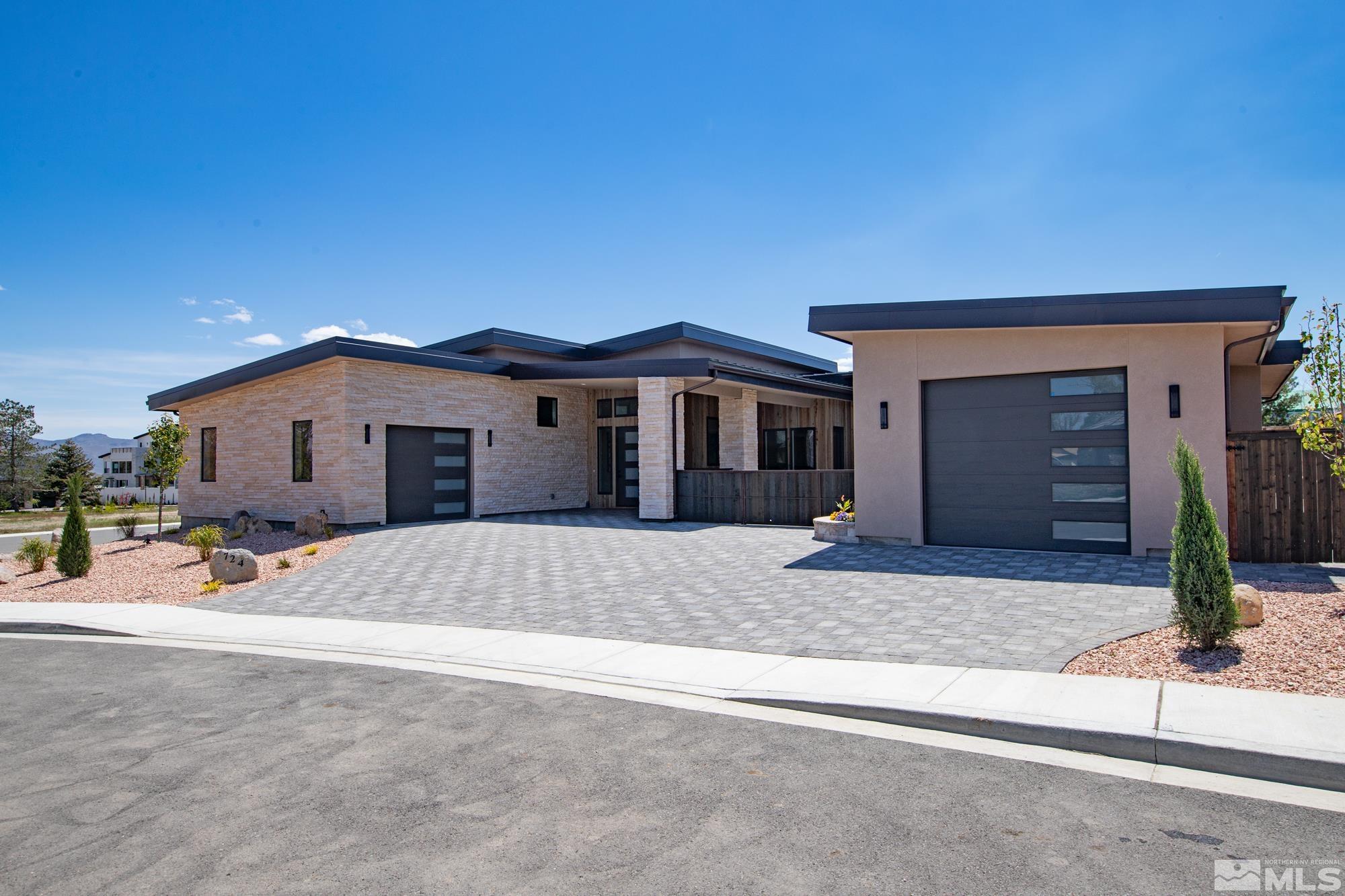 724 Canter Way Reno, NV 89511 - Photo 3 of 40 a front view of a house with a outdoor space