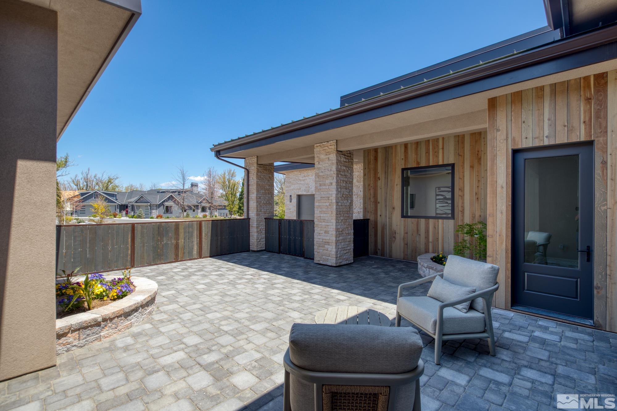 724 Canter Way Reno, NV 89511 - Photo 8 of 40 a view of a porch with furniture and a yard