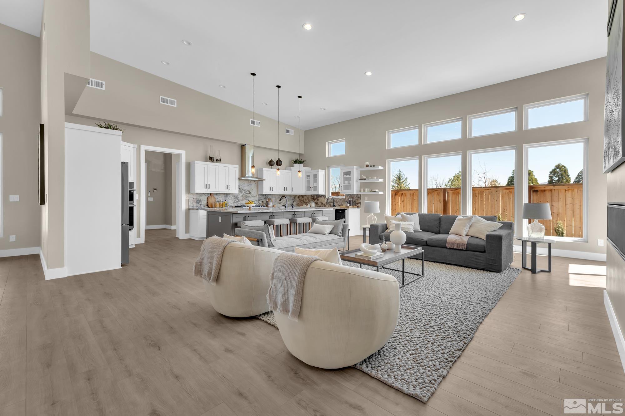 724 Canter Way Reno, NV 89511 - Photo 10 of 40 a living room with furniture and a large window