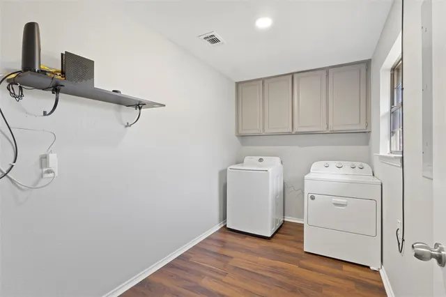 a view of storage and utility room with washer and dryer