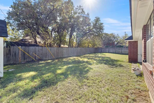 a view of a backyard with tree s